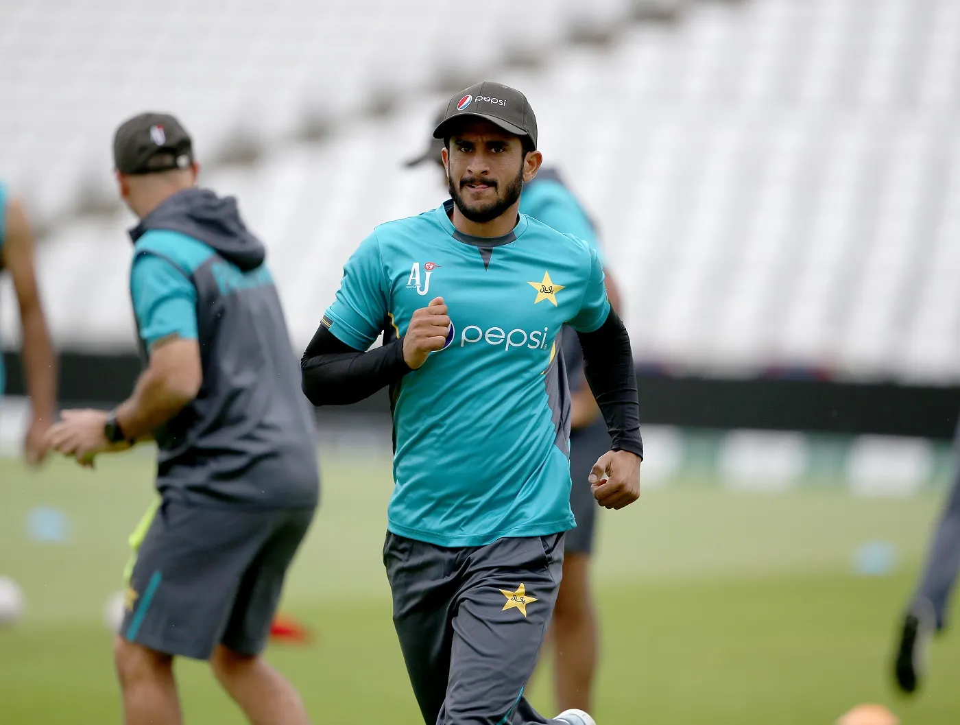 Hasan Ali friendly tussle with PCT masseur before Australia series. In a widely circulated video, Hasan Ali, a Pakistan cricketer, is seen playfully wrestling